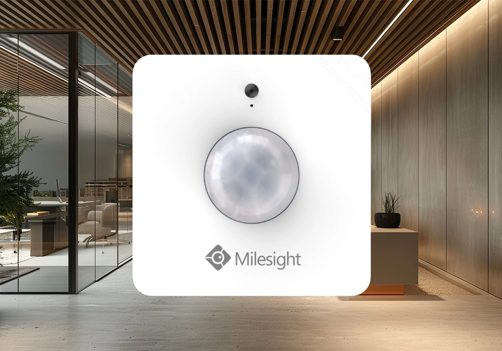 The Milesight WS202 motion and light level sensor. The background is a stylish office space. The Milesight WS202 motion and light level sensor. The background is a stylish office space.