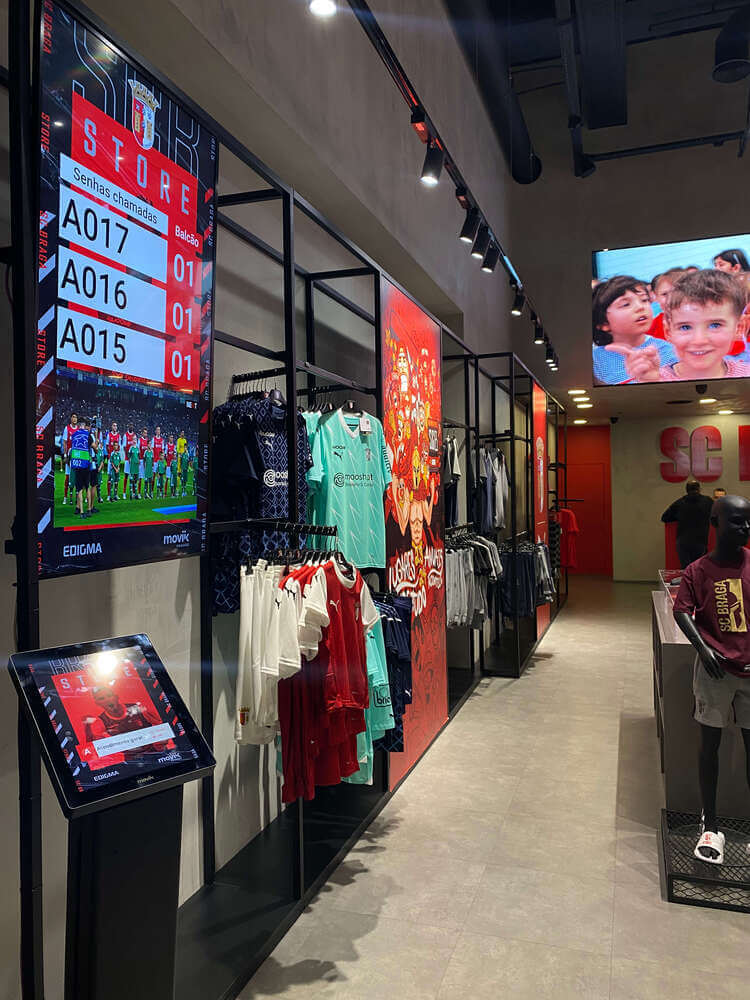 Installation of the queueing kiosk and digital signage player inside SC Braga official store, showing the setup in action.
