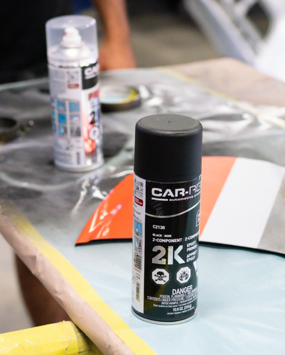 Various Car-Rep primer cans and underbody coatings for corrosion protection and adhesion.