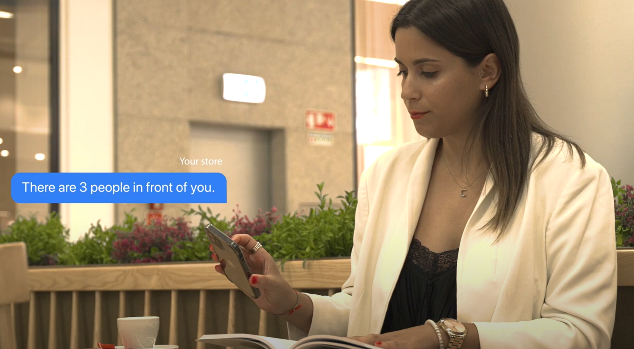 Customers using their waiting time freely while their spot in the queue is secured, demonstrating the benefits of a digital queue management system.