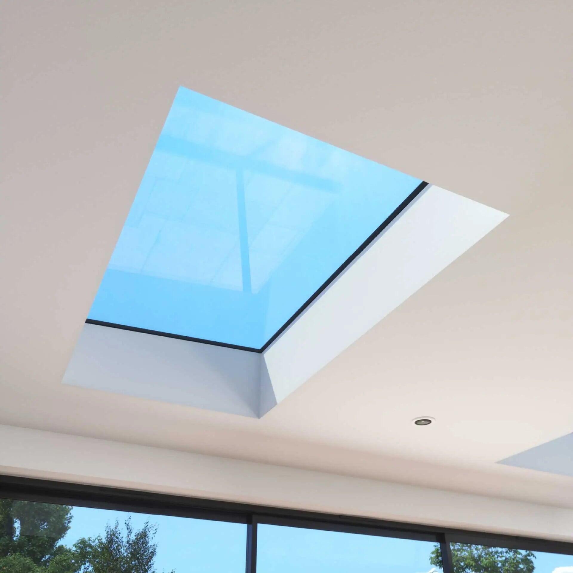 Slim profile Korniche aluminium bi-fold doors opening smoothly onto a modern garden patio extension Slim profile Korniche aluminium bi-fold doors opening smoothly onto a modern garden patio extension