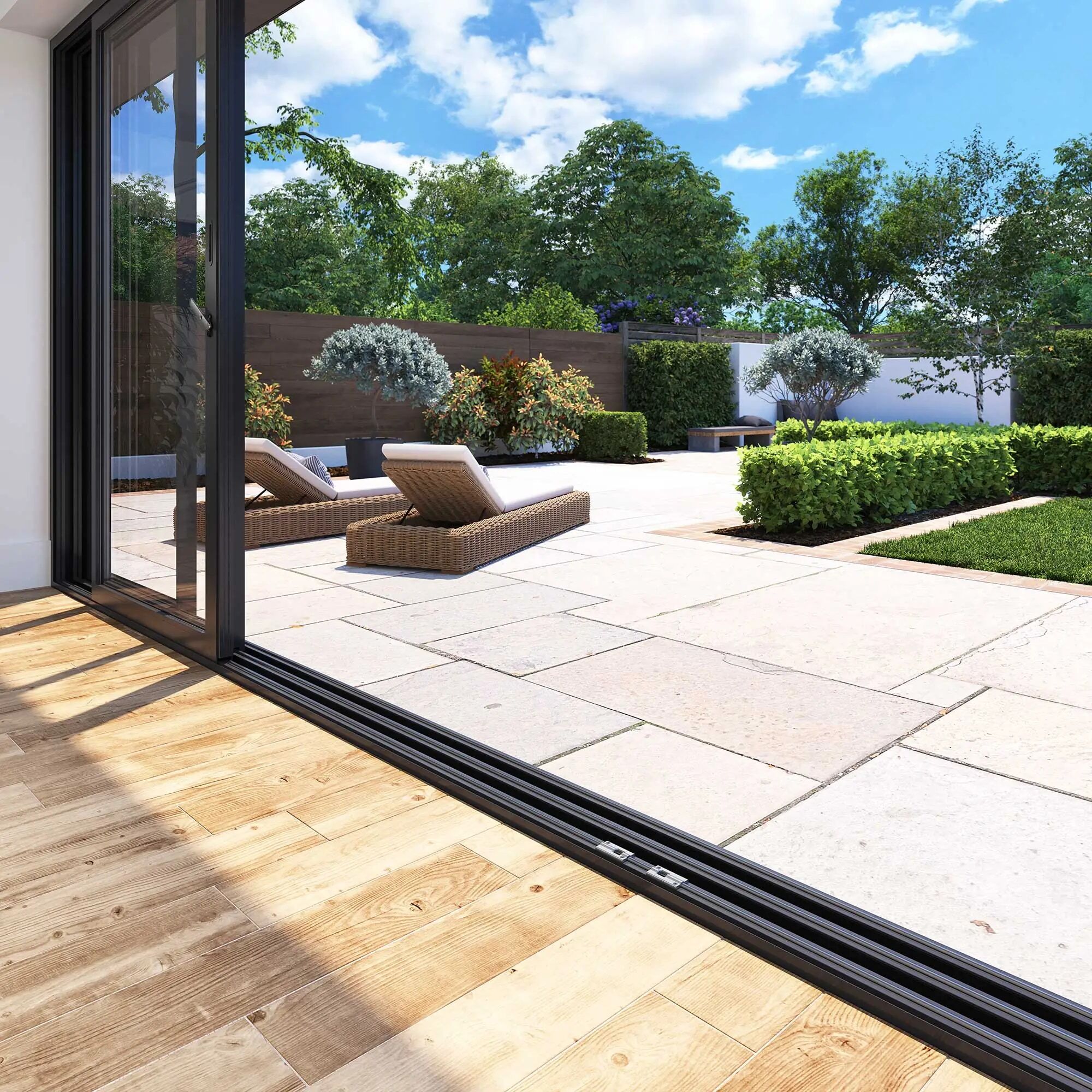 Slim profile Korniche aluminium bi-fold doors opening smoothly onto a modern garden patio extension